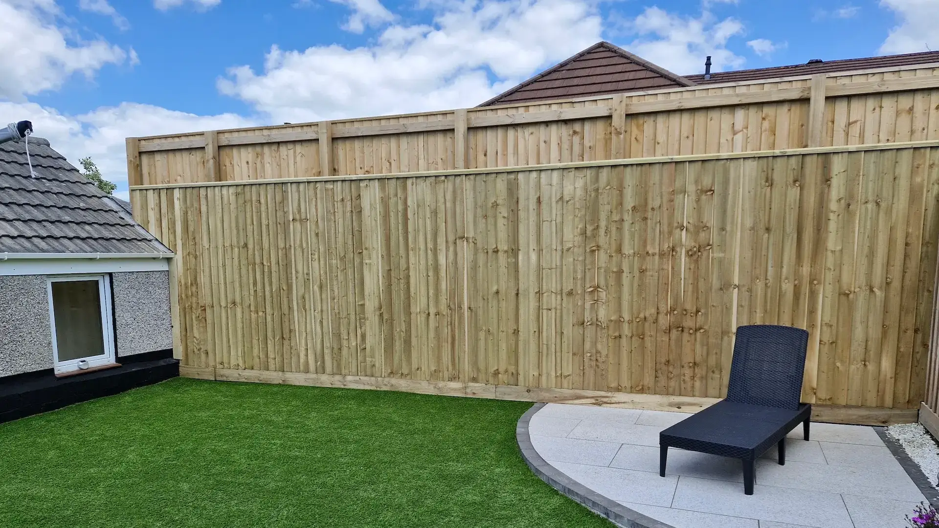 a new wooden fence in a back garden
